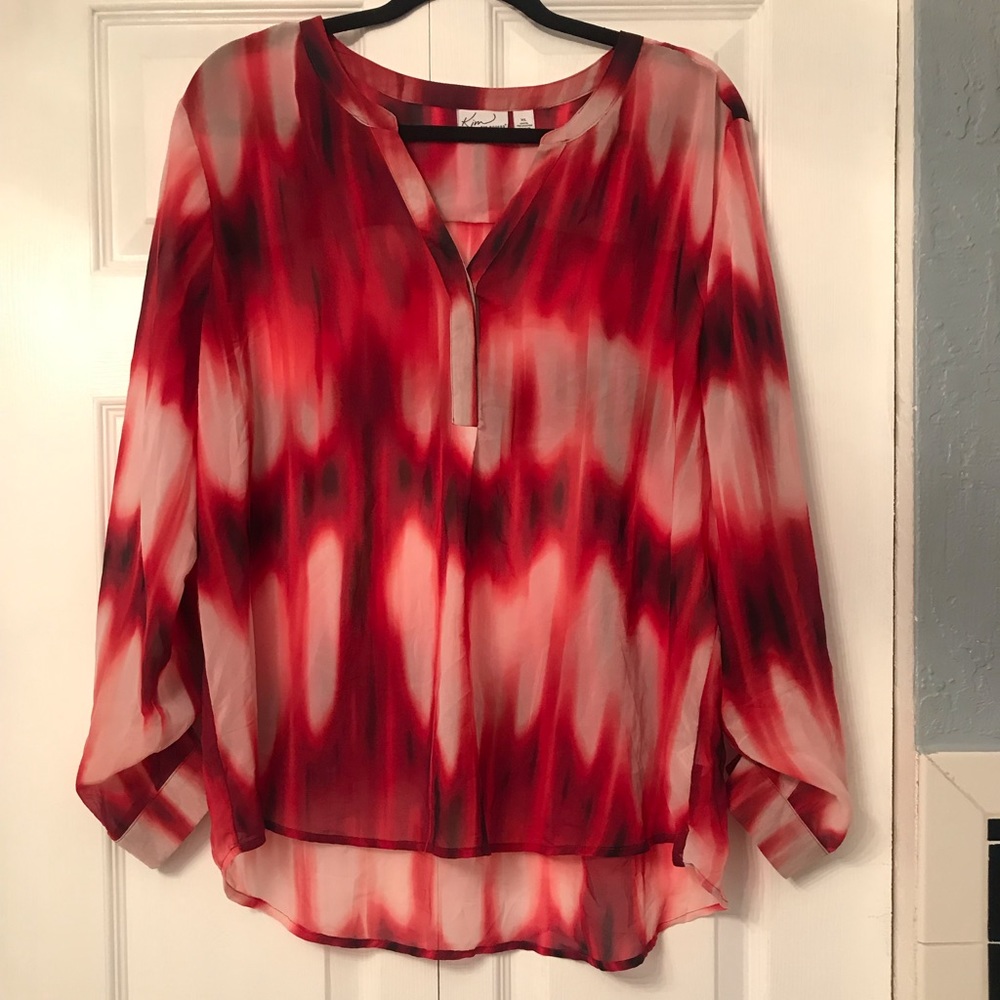 Kim Rogers red blouse